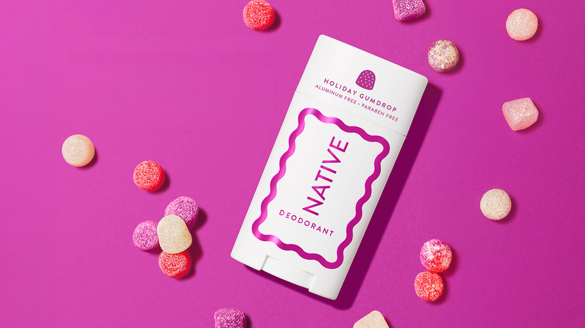 Native Gumdrop on a pink background with gumdrops around the product